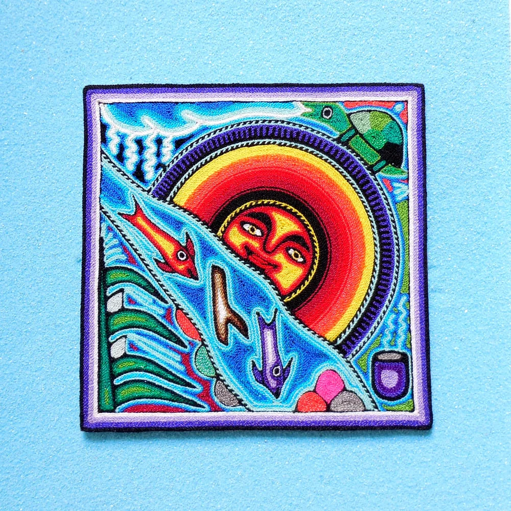 Huichol sun god and fish nierika yarn painting front view