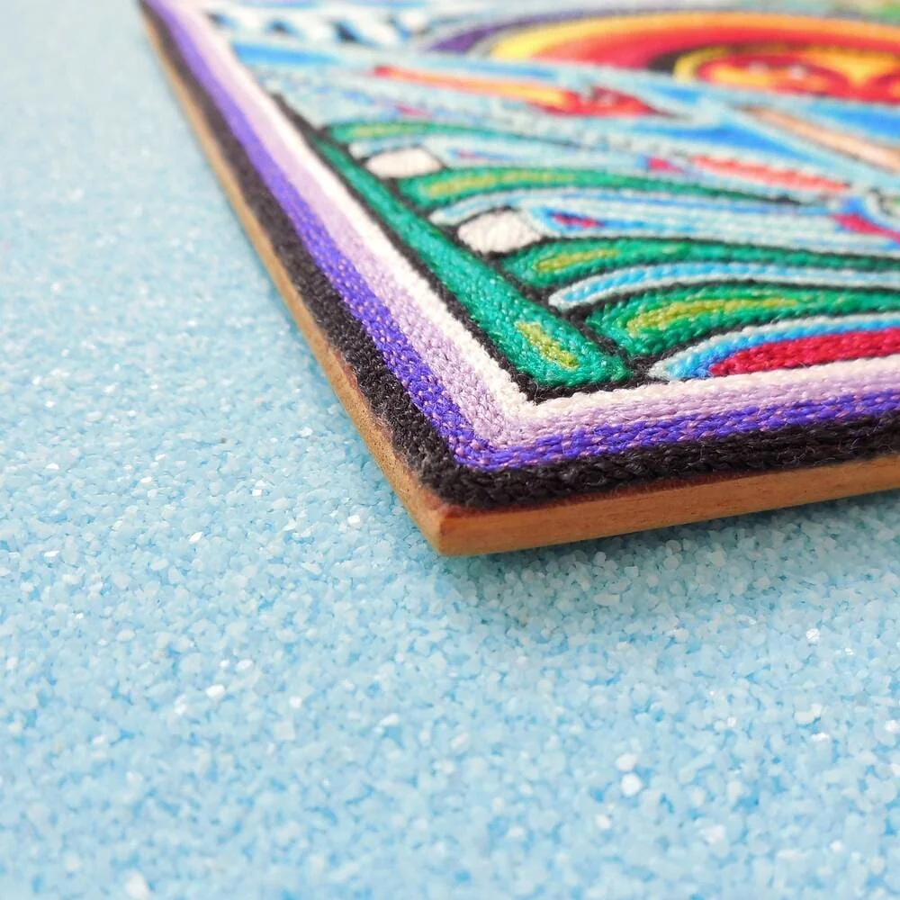 Side view of Huichol sun god and fish panel showing thickness