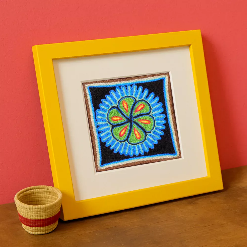 Three 4×4 inch Huichol-inspired mini peyote artwork prints in colorful frames on a pink wall. Framed Image