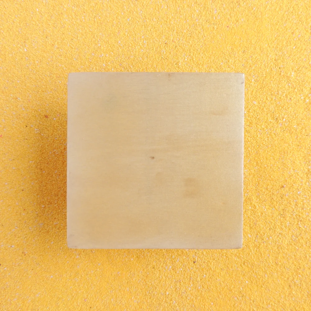 Back side of the Huichol yarn painting showing the wooden base construction of the 10cm piece.