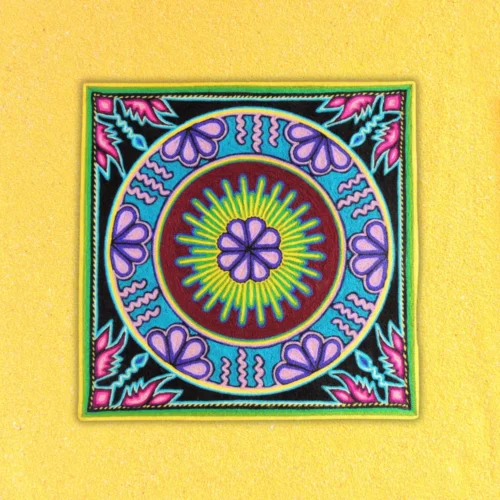 Front view of Huichol yarn painting with peyote motif and circular pattern